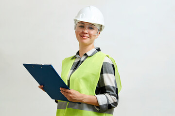 Portrait of female construction worker on white background