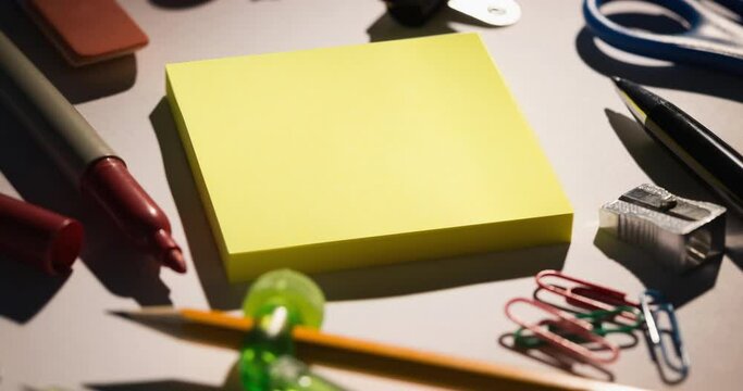 Animation of memo notes and school stationery on messy desk