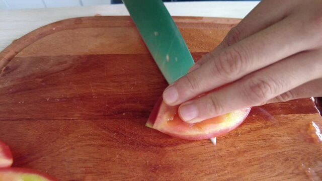 concasse tomato peeling technique on a wooden table