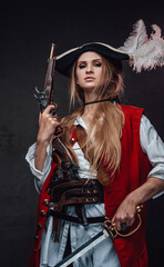 Female mercenary pirate with gun and sword