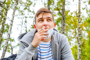Young Man smoke a Cigarette