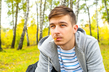 Young Man smoke a Cigarette