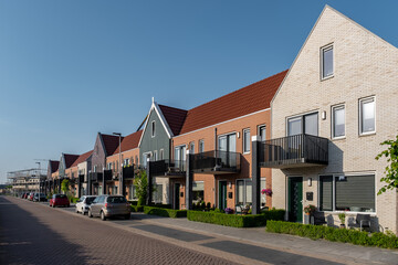 Dutch Suburban area with modern family houses, newly build modern family homes in the Netherlands, dutch family house, apartment house. Netherlands - obrazy, fototapety, plakaty