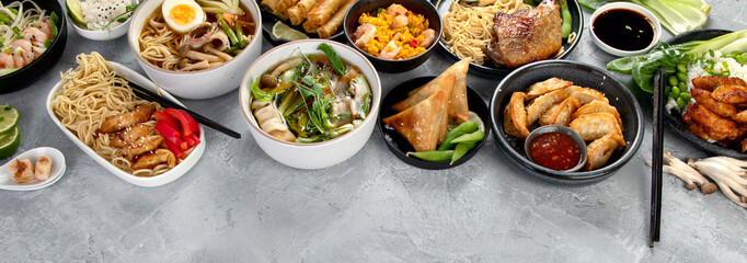 Assorted asian dishes and snacks on dark gray background. Traditional food concept.