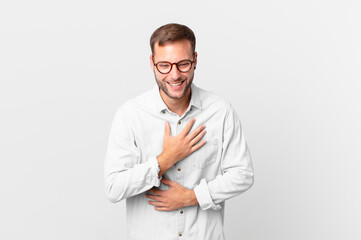 handsome blonde man laughing out loud at some hilarious joke