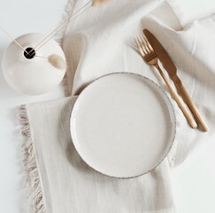 Empty modern minimal table place setting neutral beige color top view.  Space for text or menu...