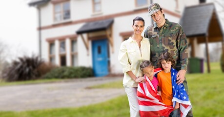 Fototapeta premium Composition of soldier with his wife and children wrapped in american flag