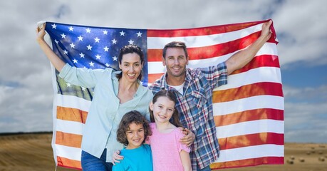 Composition of portrait of smiling caucasian couple with son and daughter holding american flag