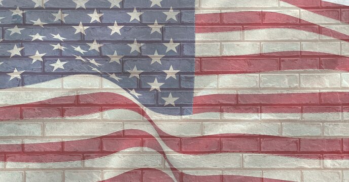 Composition of american flag over brick wall
