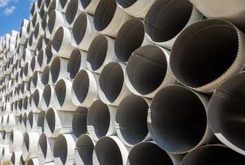 Downpipe warehouse. Steel pipes, parts for the construction of a roof drainage system in a...