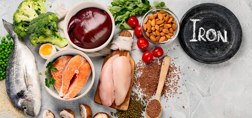 Food high in iron on light gray background. Healthy eating concept.