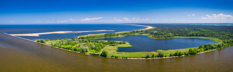 The beautiful scenery of the lake by the beach of the Baltic Sea, Mikoszewo. Poland - obrazy, fototapety, plakaty