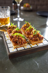 Veal tartare on garlic croutons