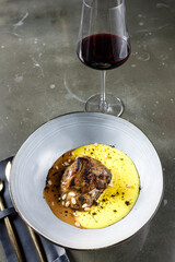 calf cheek in red wine with creamy banosh and baked oyster mushrooms