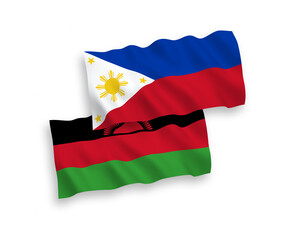 National vector fabric wave flags of Malawi and Philippines isolated on white background. 1 to 2 proportion.