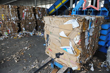 Almaty, Kazakhstan - 06.17.2016 : Special equipment compresses and recycles piles of various...