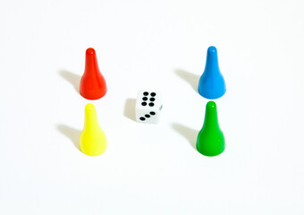 Closeup shot of four tokens with dice on white background