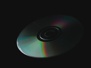 CD or DVD on dark background.