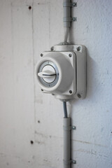 Wall mounted old fashion industrial grade power switch close up shot no people