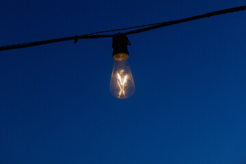 a light bulb burning in the dark