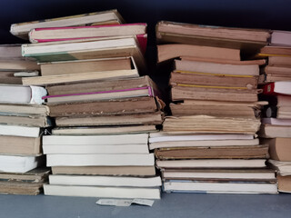 books  old aged in the dust pile stack isolated for background