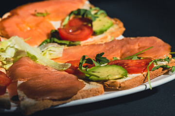 grilled salmon with tomato and avocado