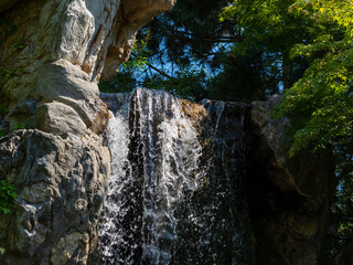 waterfall, water beats against stones