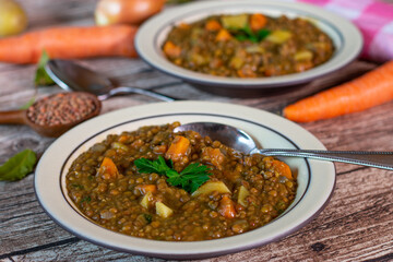 A plate with fresh cooked vegetarian and vegan lentil soup