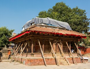 Temple supported by beams after powerful earthquake.