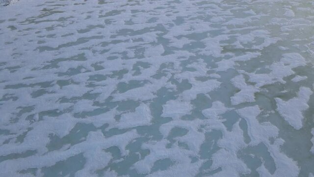 The lake under ice in tundra on Taimyr