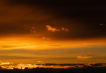 Sunset sky with orange clouds. Nature background.