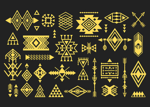 Golden like silhouette trendy Aztec and tribal signs and symbols design elements set on black background