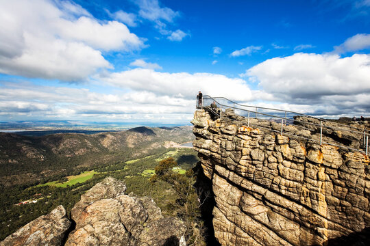 Landscape of people at lookout overlooking valley