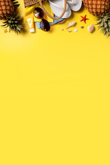 Summer fruit background design concept. Beach with shells, pineapple and palm leaves on yellow background.