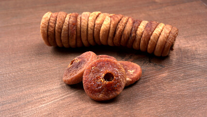 Fresh Figs or Anjeer fruit healthy vegan food concept organic dry fruits on wooden background.