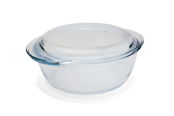 Transparent pan for cooking and baking made of heat-resistant glass, closed with a lid. Close-up on...