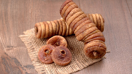 Fresh Figs or Anjeer fruit healthy vegan food concept organic dry fruits on wooden background.