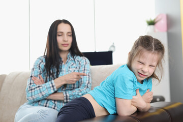 Fototapeta premium Mother scolding naughty little girl at home