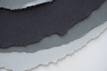 low-key ripped paper background in grey