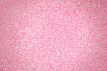 Shiny pink blurred background with vignetting.