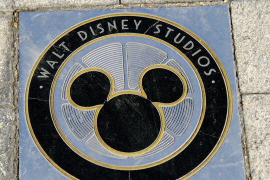 Walt Disney Studios logo on the marble and stone floor. Disney Land Paris. Mickey Mouse logo. The magic of Disney Europe. Mickey mouse icon.