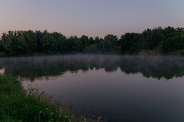 Fototapeta na wymiar beautiful landscape with lake trees reflected in water
