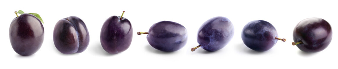 Tasty sweet plums on white background