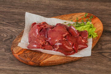 Raw chicken liver over board