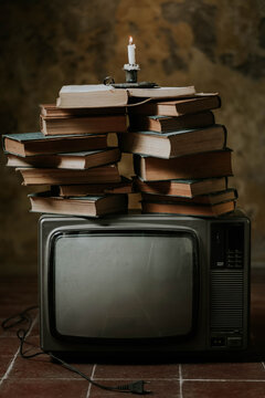 Stack of books on retro TV