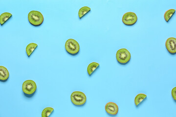 Cut ripe kiwi on color background