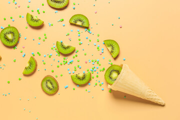 Composition with waffle cone and ripe kiwi on color background