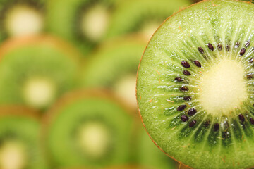 Tasty ripe kiwi on blurred background