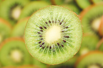 Tasty ripe kiwi on blurred background