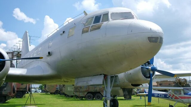 White old plane on exhibition in open-air museum. Going sightseeing in summer